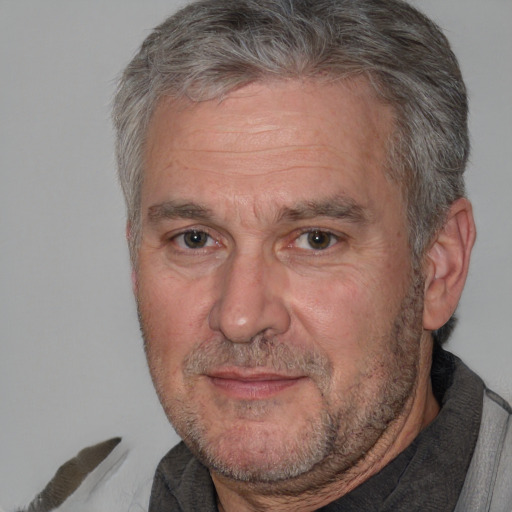 Neutral white middle-aged male with short  gray hair and brown eyes