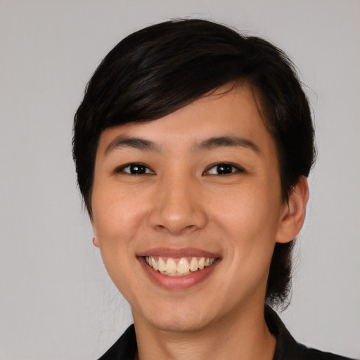 Joyful white young-adult female with short  black hair and brown eyes