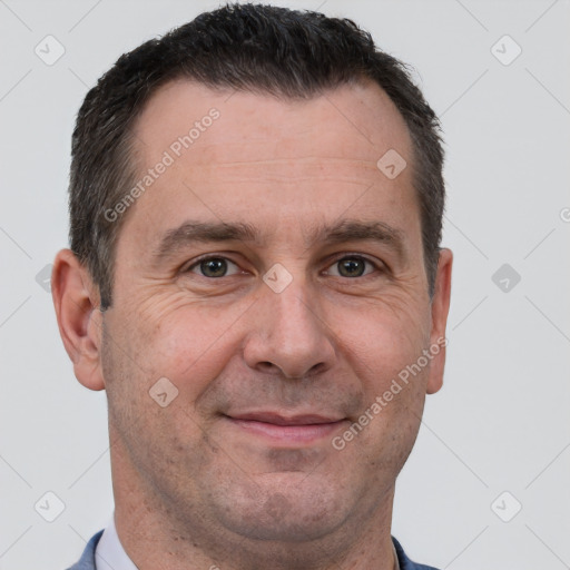 Joyful white adult male with short  brown hair and brown eyes