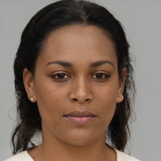 Neutral latino young-adult female with medium  brown hair and brown eyes