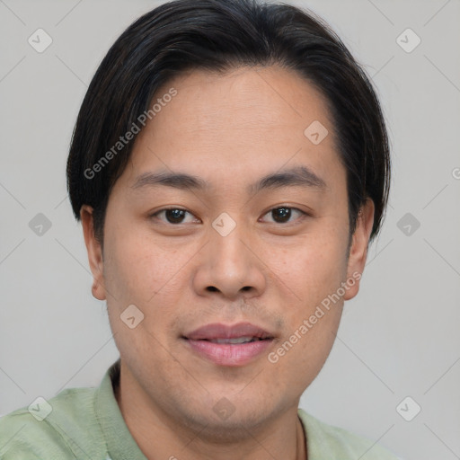 Joyful asian young-adult male with short  brown hair and brown eyes