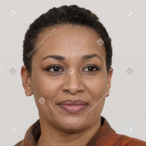 Joyful latino adult female with short  brown hair and brown eyes