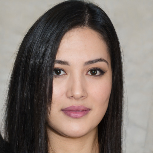 Joyful white young-adult female with long  black hair and brown eyes