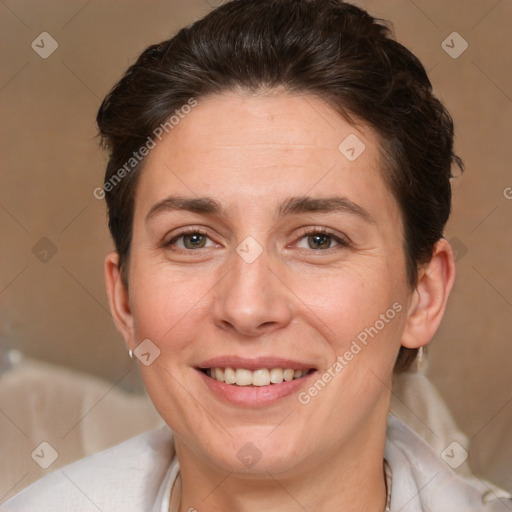 Joyful white adult female with short  brown hair and brown eyes