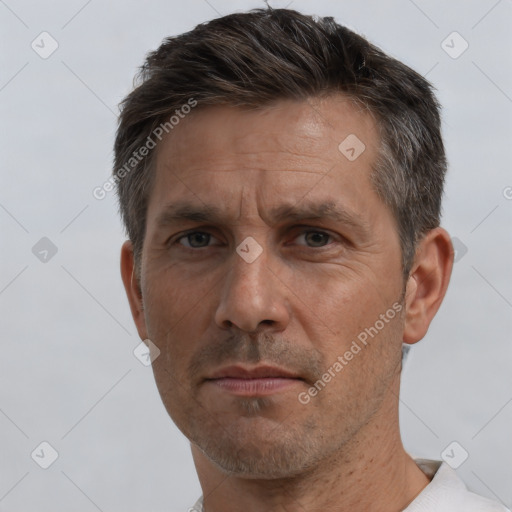 Neutral white adult male with short  brown hair and brown eyes