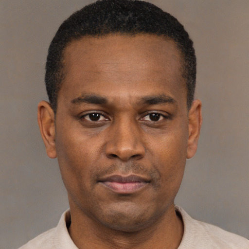 Neutral black young-adult male with short  black hair and brown eyes
