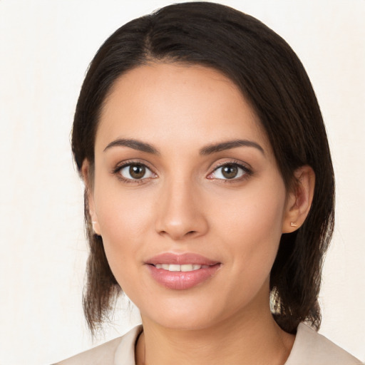 Joyful white young-adult female with medium  brown hair and brown eyes