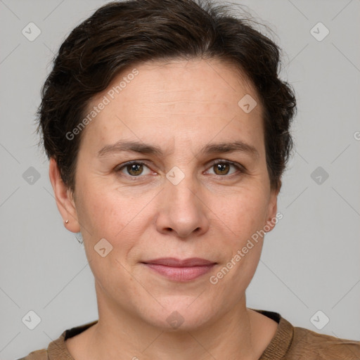 Joyful white adult female with short  brown hair and grey eyes