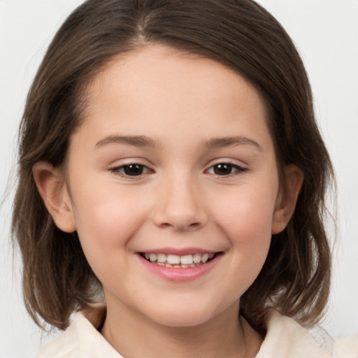 Joyful white child female with medium  brown hair and brown eyes