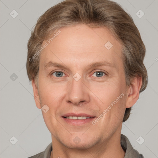 Joyful white adult male with short  brown hair and grey eyes