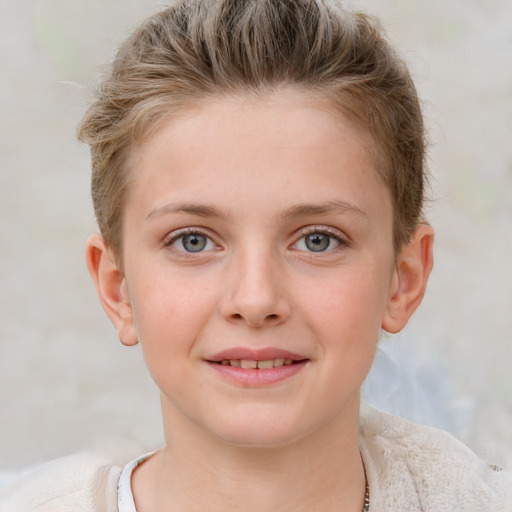 Joyful white child female with short  brown hair and blue eyes