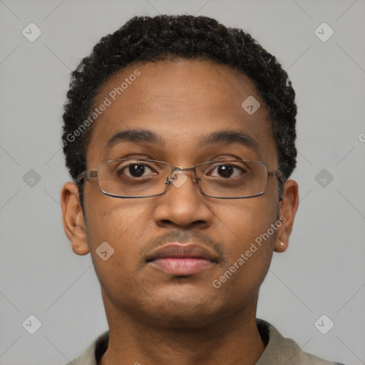 Neutral black young-adult male with short  brown hair and brown eyes