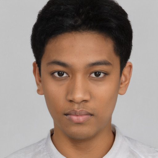 Neutral latino young-adult male with short  black hair and brown eyes