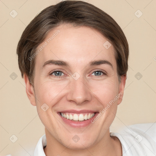 Joyful white adult female with short  brown hair and grey eyes