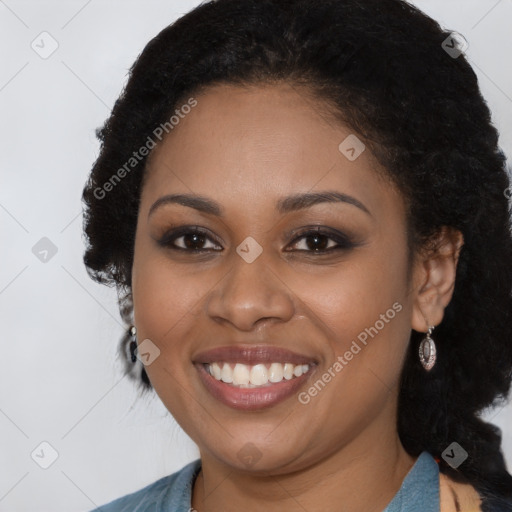 Joyful black young-adult female with long  brown hair and brown eyes