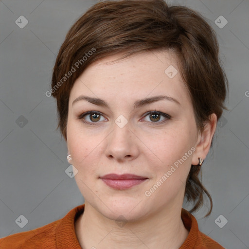 Joyful white young-adult female with medium  brown hair and grey eyes