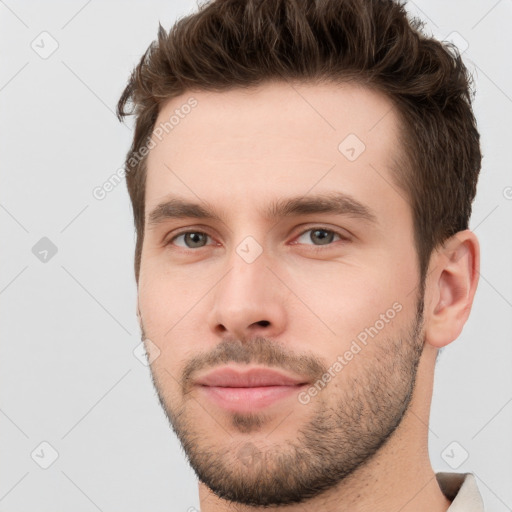 Neutral white young-adult male with short  brown hair and brown eyes