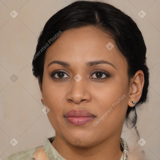 Joyful latino young-adult female with medium  brown hair and brown eyes