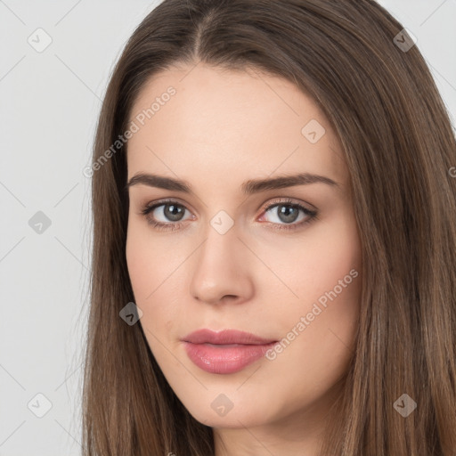 Neutral white young-adult female with long  brown hair and brown eyes