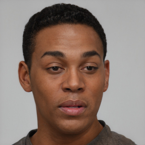 Neutral black young-adult male with short  black hair and brown eyes