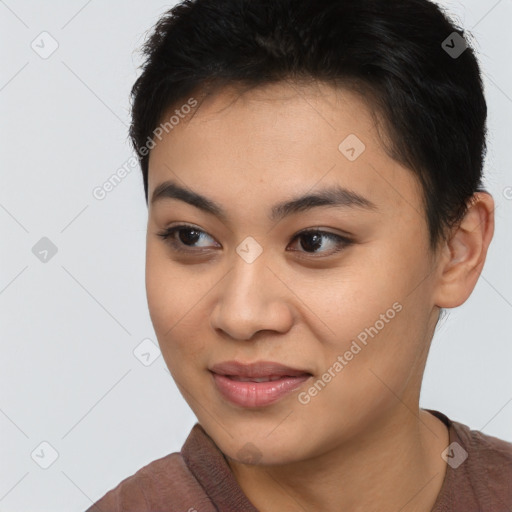 Joyful asian young-adult female with short  brown hair and brown eyes