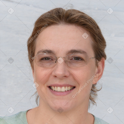 Joyful white young-adult female with short  brown hair and blue eyes