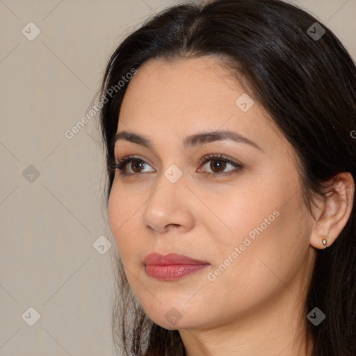 Joyful white young-adult female with long  brown hair and brown eyes