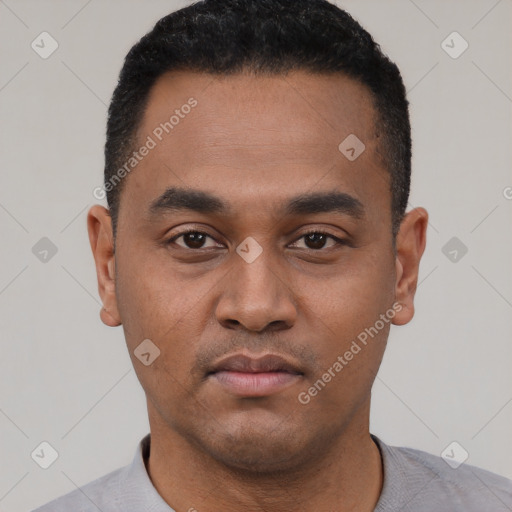 Neutral latino young-adult male with short  black hair and brown eyes