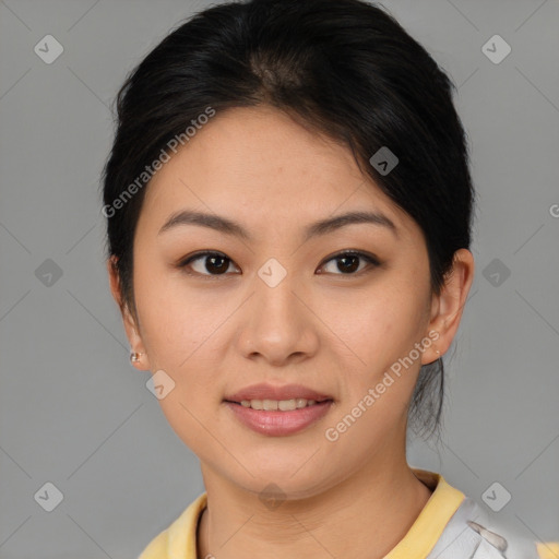 Joyful asian young-adult female with short  brown hair and brown eyes