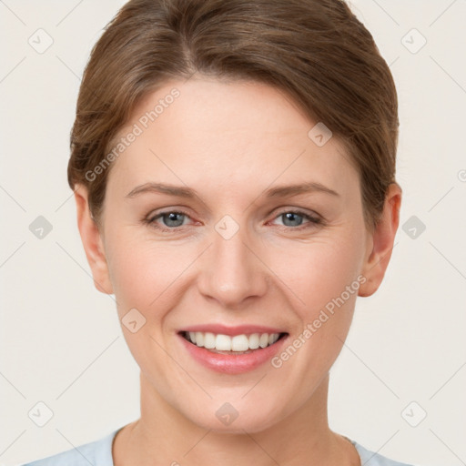 Joyful white young-adult female with short  brown hair and grey eyes