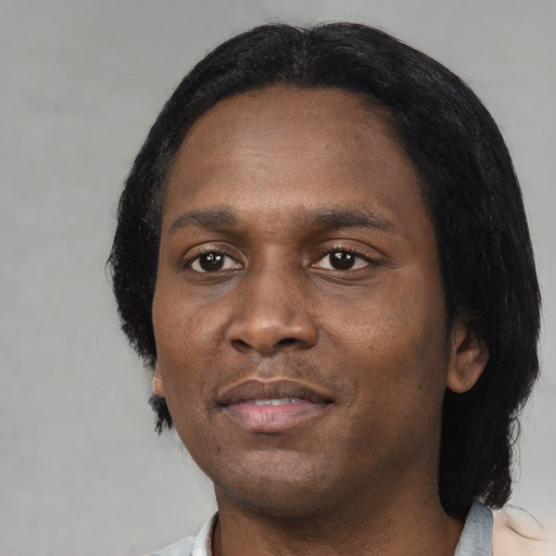 Neutral black adult male with short  black hair and brown eyes