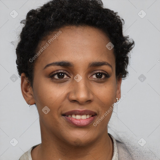 Joyful black young-adult female with short  brown hair and brown eyes