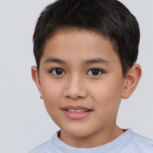 Joyful white child male with short  brown hair and brown eyes