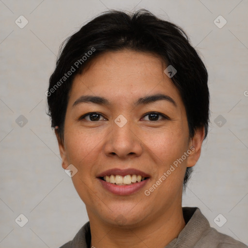 Joyful asian young-adult female with short  black hair and brown eyes