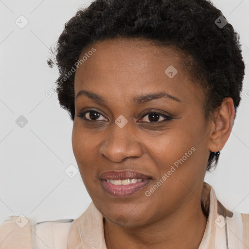 Joyful black young-adult female with short  brown hair and brown eyes