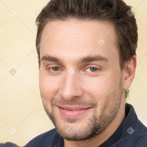 Joyful white young-adult male with short  brown hair and brown eyes