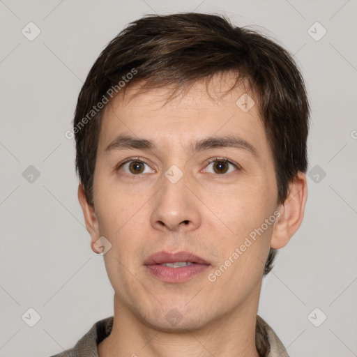 Neutral white young-adult male with short  brown hair and brown eyes