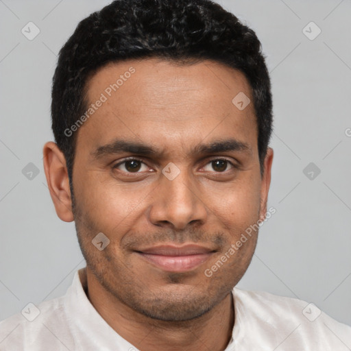 Joyful latino young-adult male with short  brown hair and brown eyes