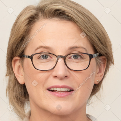 Joyful white adult female with medium  brown hair and blue eyes