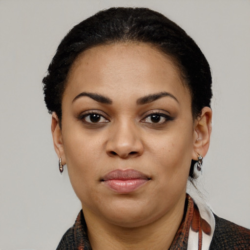 Joyful latino young-adult female with medium  black hair and brown eyes