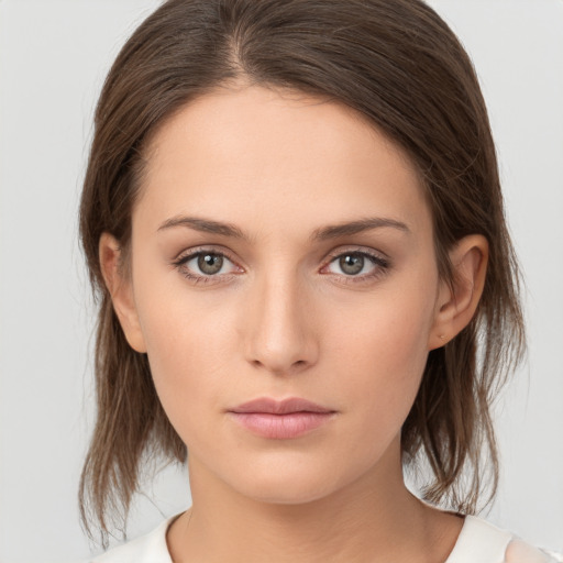 Neutral white young-adult female with medium  brown hair and brown eyes