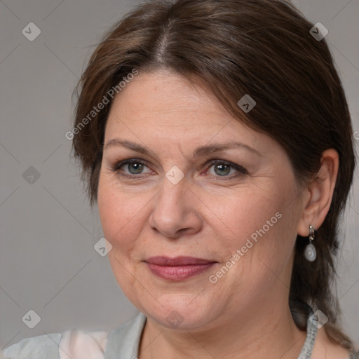 Joyful white adult female with medium  brown hair and grey eyes