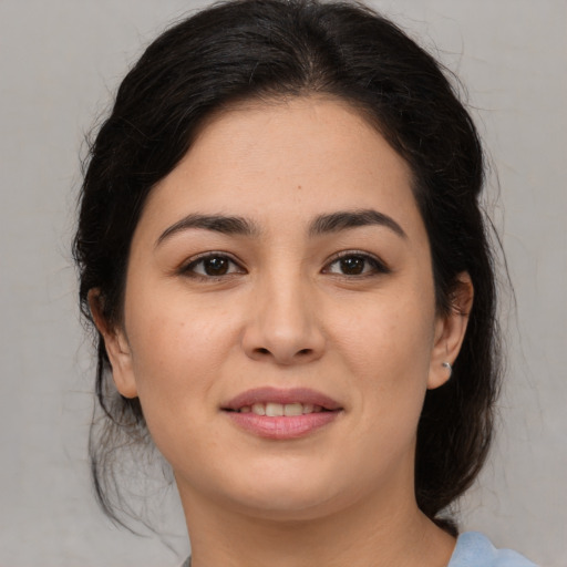 Joyful asian young-adult female with medium  brown hair and brown eyes