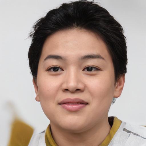 Joyful asian young-adult female with short  brown hair and brown eyes