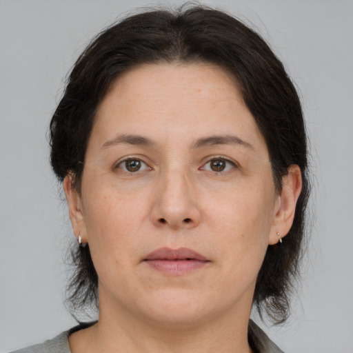 Neutral white adult female with medium  brown hair and brown eyes