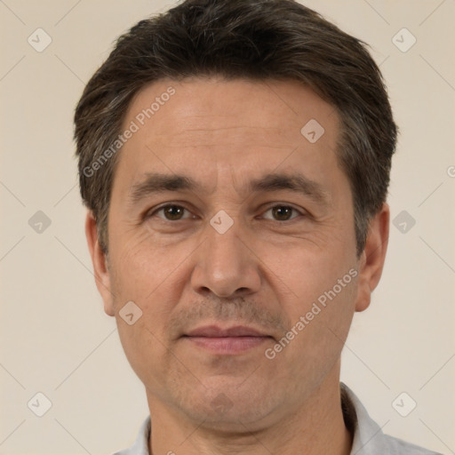 Joyful white adult male with short  brown hair and brown eyes