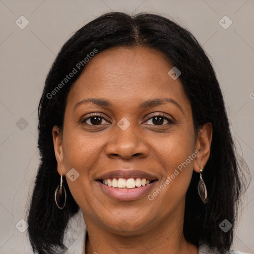 Joyful black young-adult female with medium  brown hair and brown eyes