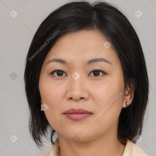 Joyful asian young-adult female with medium  brown hair and brown eyes