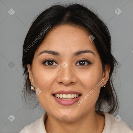 Joyful latino young-adult female with medium  brown hair and brown eyes