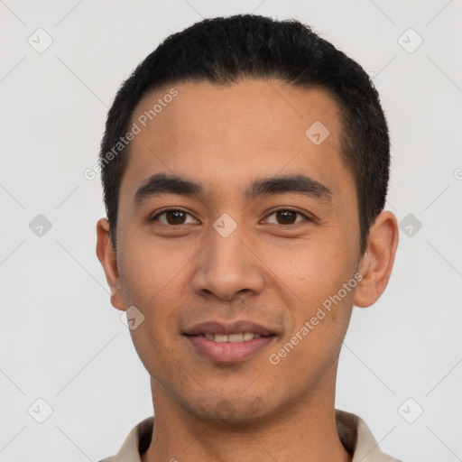 Joyful latino young-adult male with short  black hair and brown eyes